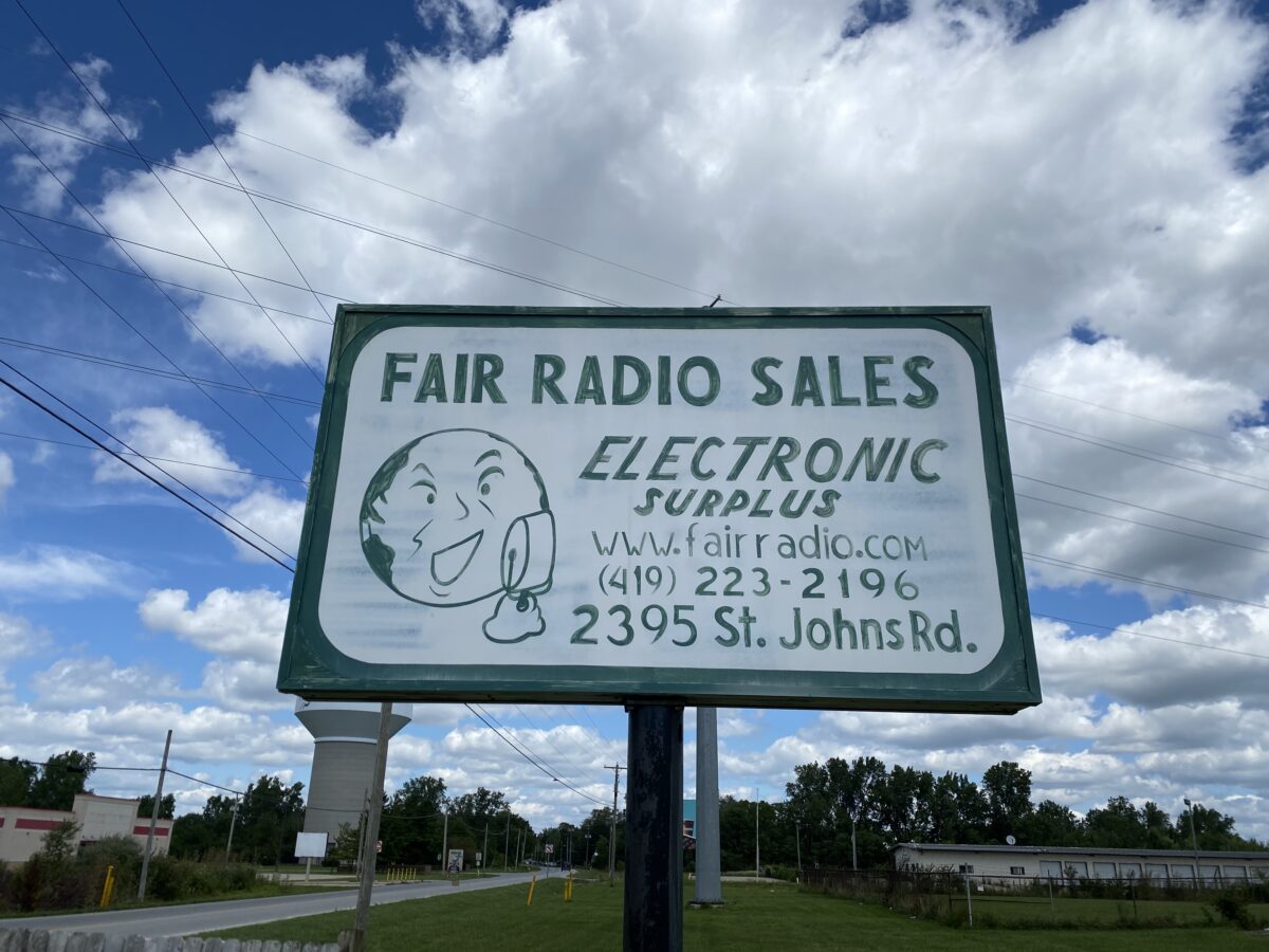 Fair Radio Sales sign against a cloudy sky